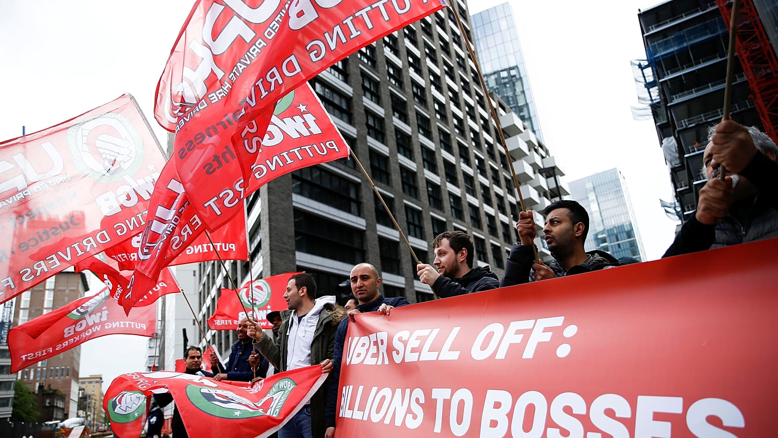 Private hire drivers protest outside the offices of Uber in London