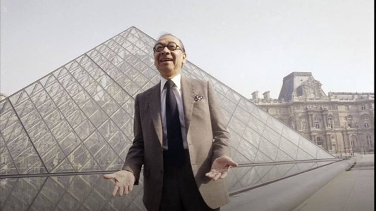 Architect I.M. Pei stands in front of the Louvre
