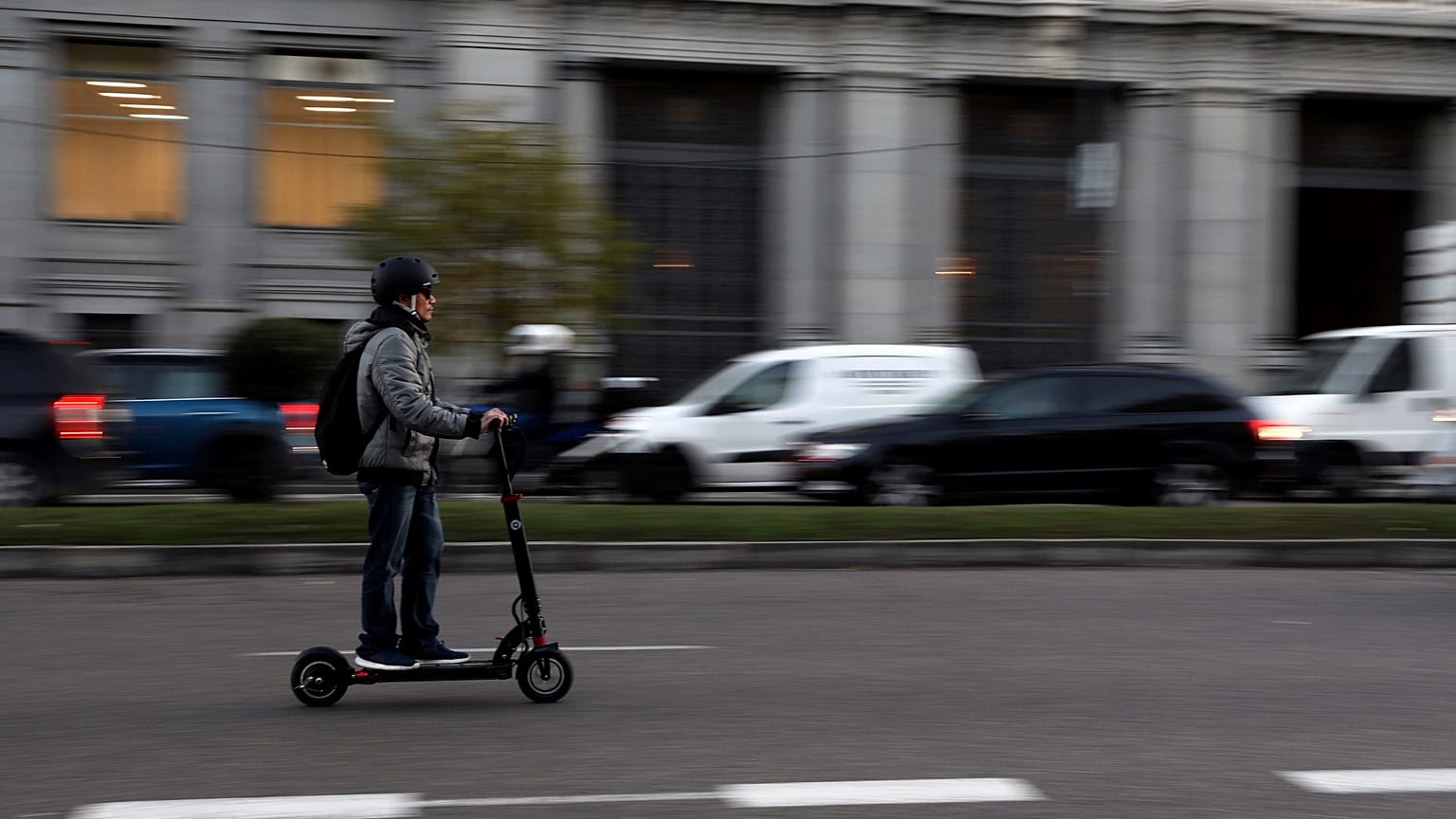 A man rides an electric scooter in Madrid, Spain, December 4, 2018.