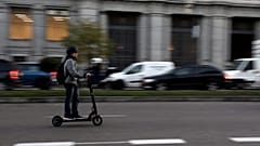 A man rides an electric scooter in Madrid, Spain, December 4, 2018.