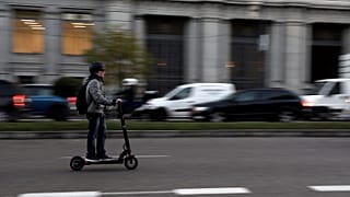 A man rides an electric scooter in Madrid, Spain, December 4, 2018.