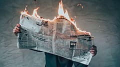 Newspaper on fire