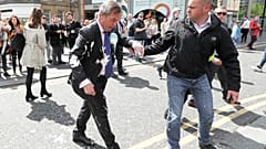 Nigel Farage doused in milkshake on the campaign trail