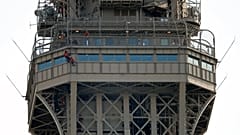 Eiffel Tower evacuated after man climbs on structure