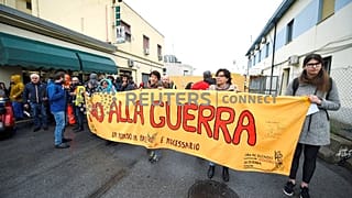 Workers on strike prevent a Saudi ship from loading cargo in Genoa