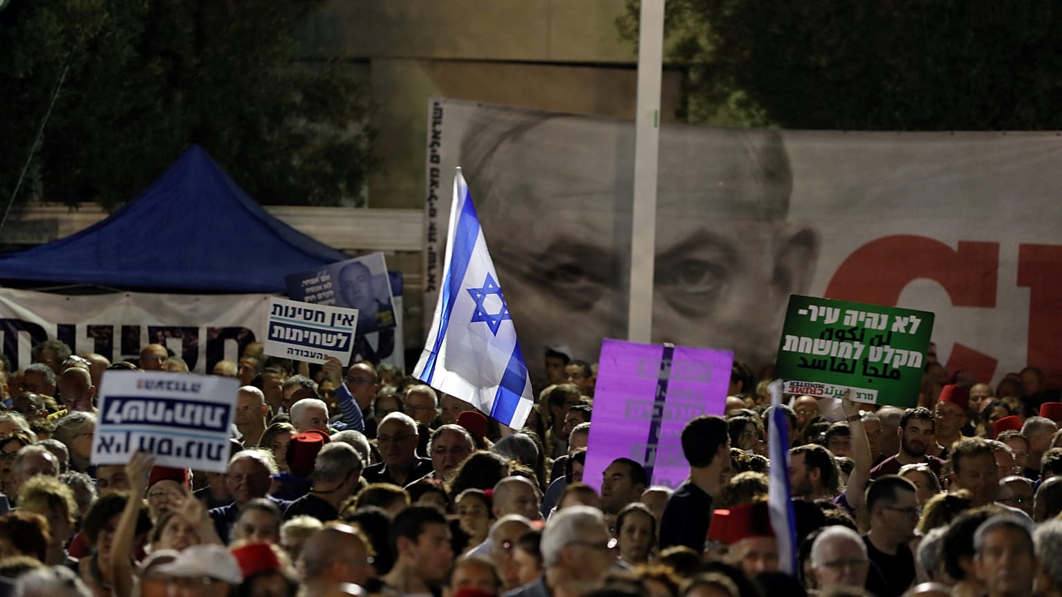 Thousands of Israelis protest legislative changes to grant PM immunity and limit Supreme Court