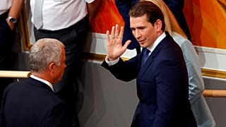 Ousted Austrian Chancellor Sebastian Kurz leaves a session of Parliament