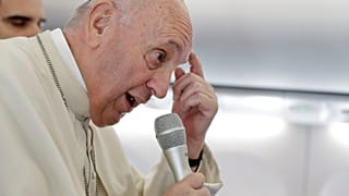 Pope Francis answers questions on the papal plane after visit to Romania