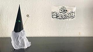 Capirote of Holy Week made with paper and a Koranic inscription