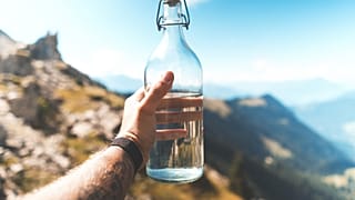 Glass water bottle, reusable.