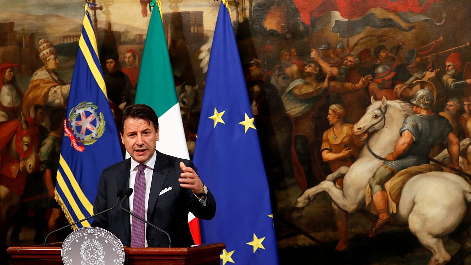 Italian Prime Minister Giuseppe Conte gestures as he holds a news conference at Chigi Palace in Rome