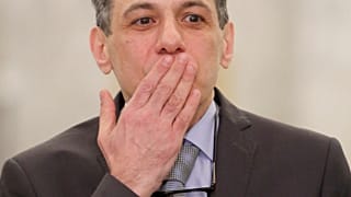 Nizar Zakka, who had been detained in Iran since 2015, gestures as he arrives in Lebanon 