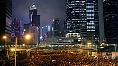 Protesters attend a demonstration demanding Hong Kong's leaders to step down