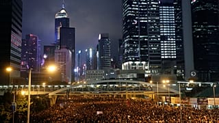 Protesters attend a demonstration demanding Hong Kong's leaders to step down