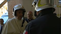 Pope Francis dons fireman's helmet to visit cathedral in Camerino 