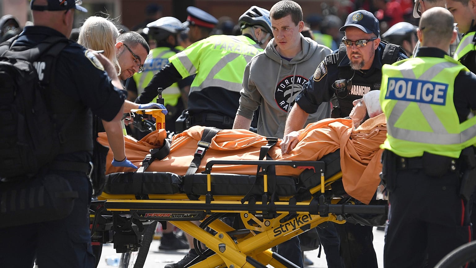 A woman is taken away by ambulance after reports of shots fired in Toronto, Canada June 17, 2019.