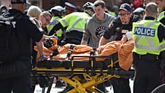 A woman is taken away by ambulance after reports of shots fired in Toronto, Canada June 17, 2019.