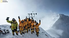 Expedition team celebrates setting up the world's highest operating automated weather station 