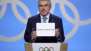 IOC-Präsident Thomas Bach verkündet den Austragungsort der Olympischen Winterspiele 2026