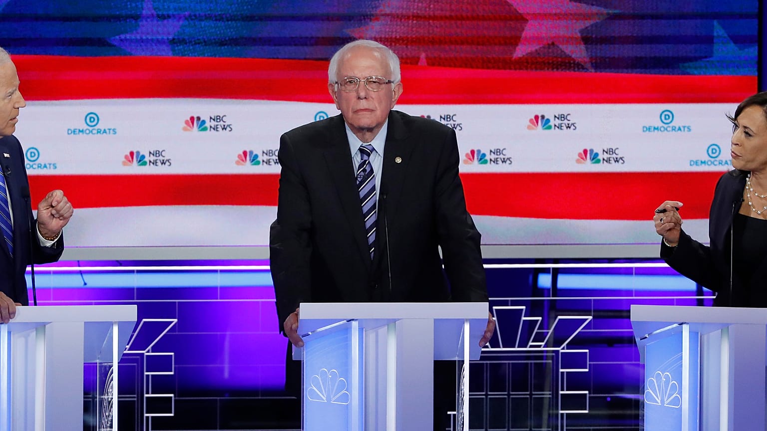 Former Vice President Joe Biden and Senator Kamala Harris debate racial issues as Senator Bernie Sanders listens