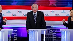 Former Vice President Joe Biden and Senator Kamala Harris debate racial issues as Senator Bernie Sanders listens