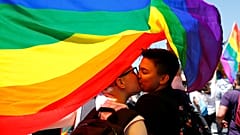 Participants kiss as they take part in the first Gay Pride parade in Skopje.