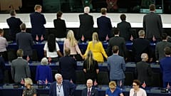 Members of the Brexit Party turn their back to the assembly as the European anthem is played, during the first plenary session of the newly elected European Parliament.