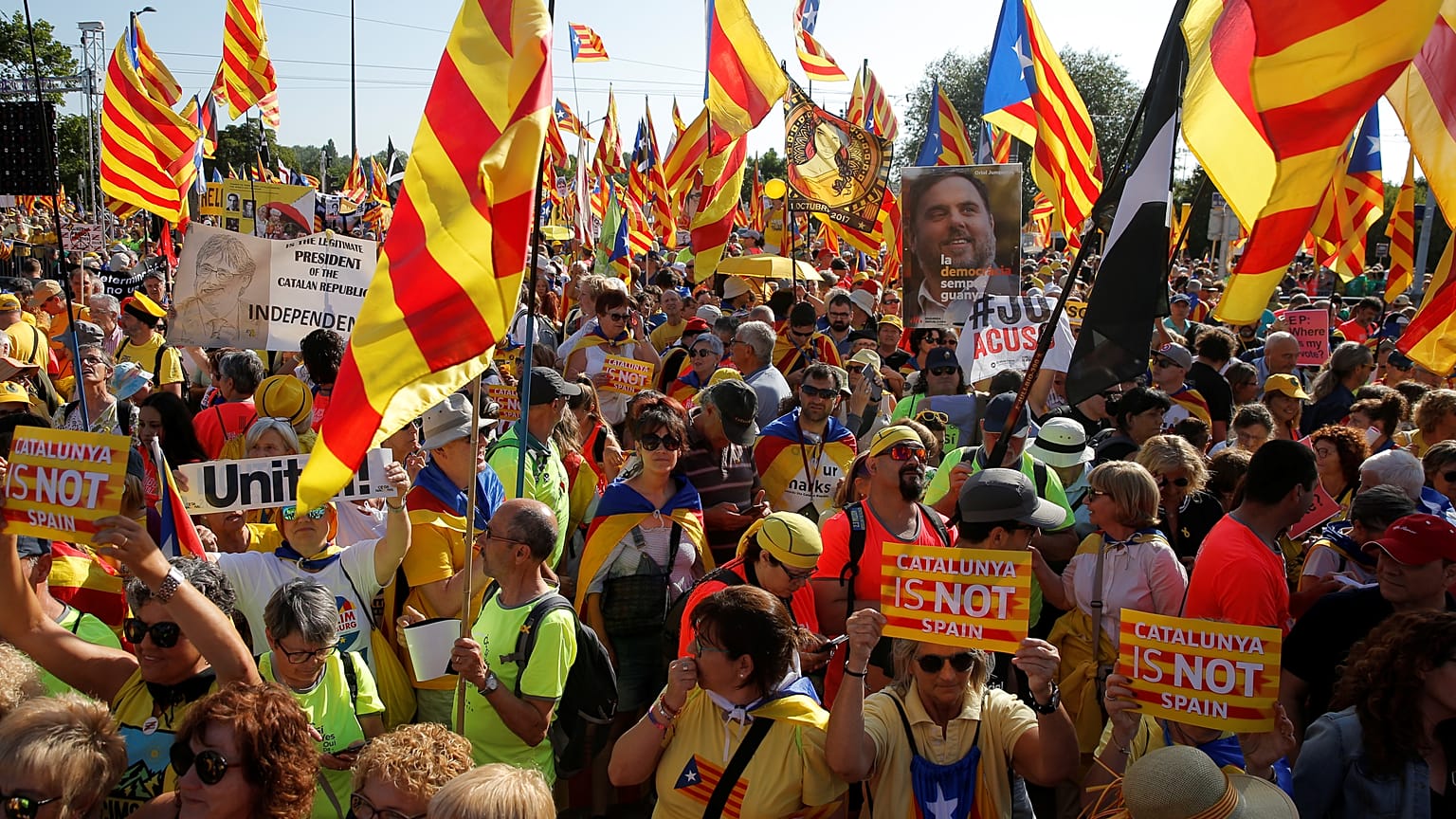 Protesters hold Catalan flags during a demonstration in front of the European Parliament in Strasbourg