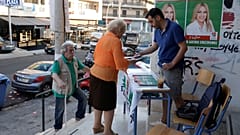 People are seen at a polling station during the general election in Athens, Greece, July 7, 2019. 