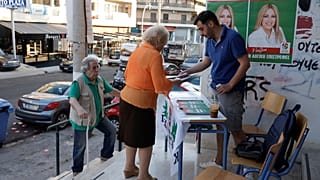 People are seen at a polling station during the general election in Athens, Greece, July 7, 2019.