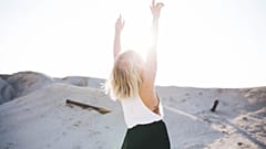 Woman with arms raised