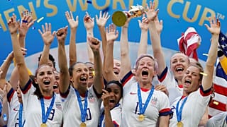 July 7, 2019 Megan Rapinoe of the U.S. and team mates celebrate winning the women's world cup with the trophy