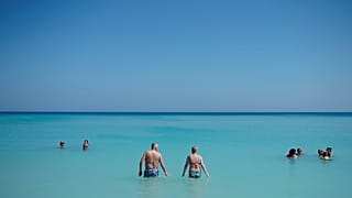 Tourists enjoy the beach in Varadero, Cuba