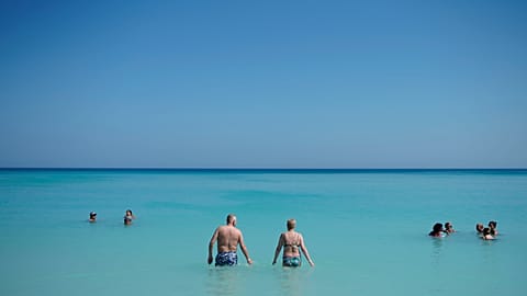 Tourists enjoy the beach in Varadero, Cuba