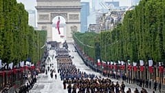 Troops walk down the Champs-Elysees avenue during the Bastille Day parade, Wednesday, July 14, 2021 in Paris. 