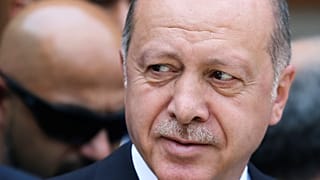 Turkey's President Recep Tayyip Erdogan pays his respects at a convoy carrying remains of the Srebrenica genocide victims, in Sarajevo, Bosnia and Herzegovina,
