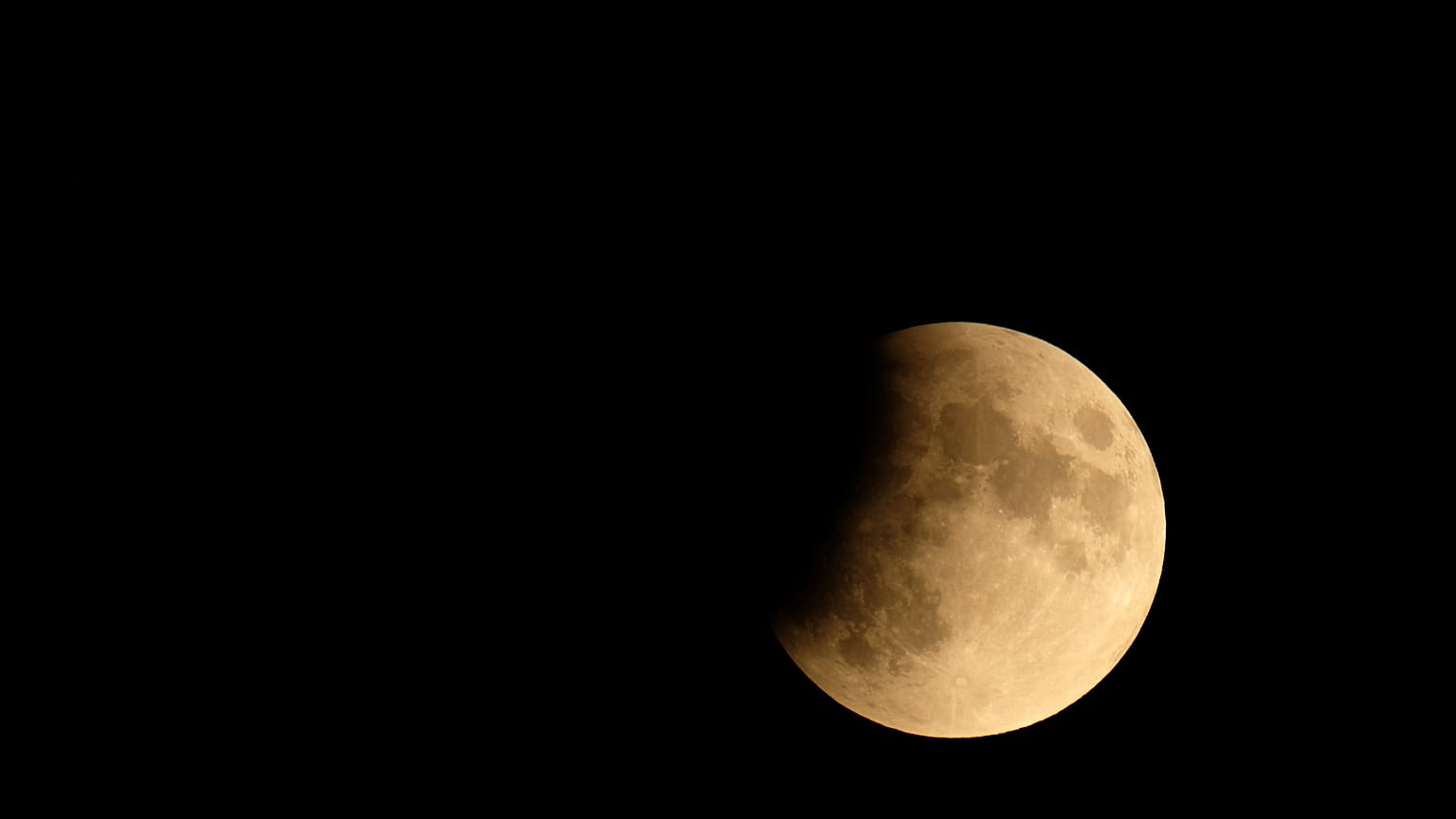 The moon is seen during a partial lunar eclipse in Venice, Italy July 16, 2019. 