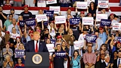 Crowd chants 'send her back' at rally after Trump accused of racism