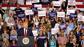 Crowd chants 'send her back' at rally after Trump accused of racism