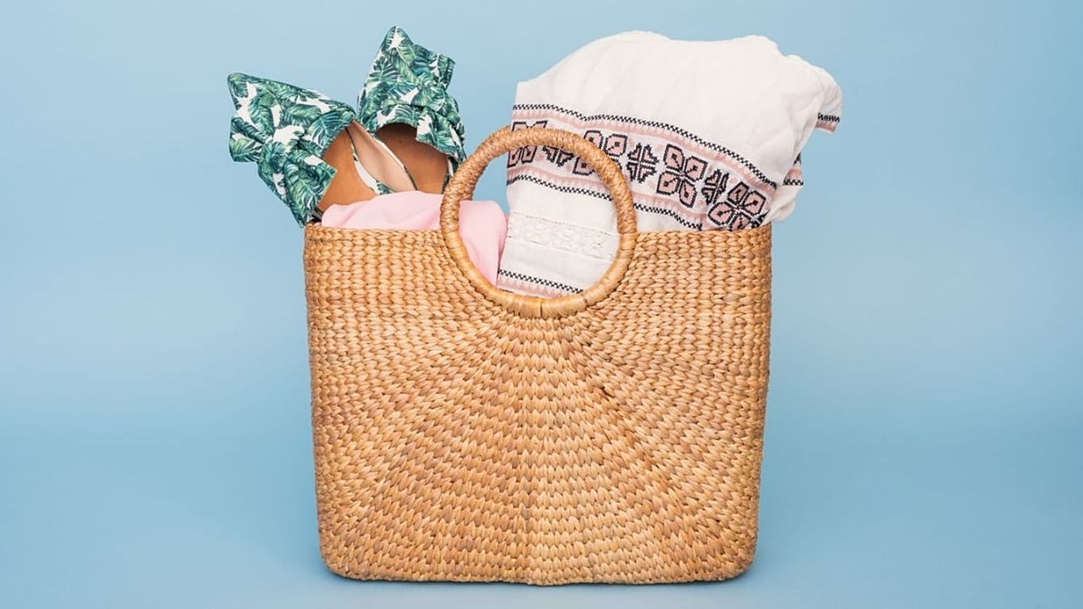 A shopping bag filled with shoes and clothes