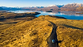 Wiebe Wakker drives his electric vehicle along Lake Tekapo, New Zealand 