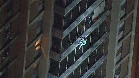 Video shows man climb down building during fire in Philadelphia