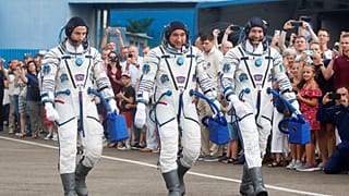 (L-R) Andrew Morgan, Alexander Skvortsov and Luca Parmitano preparing for takeoff