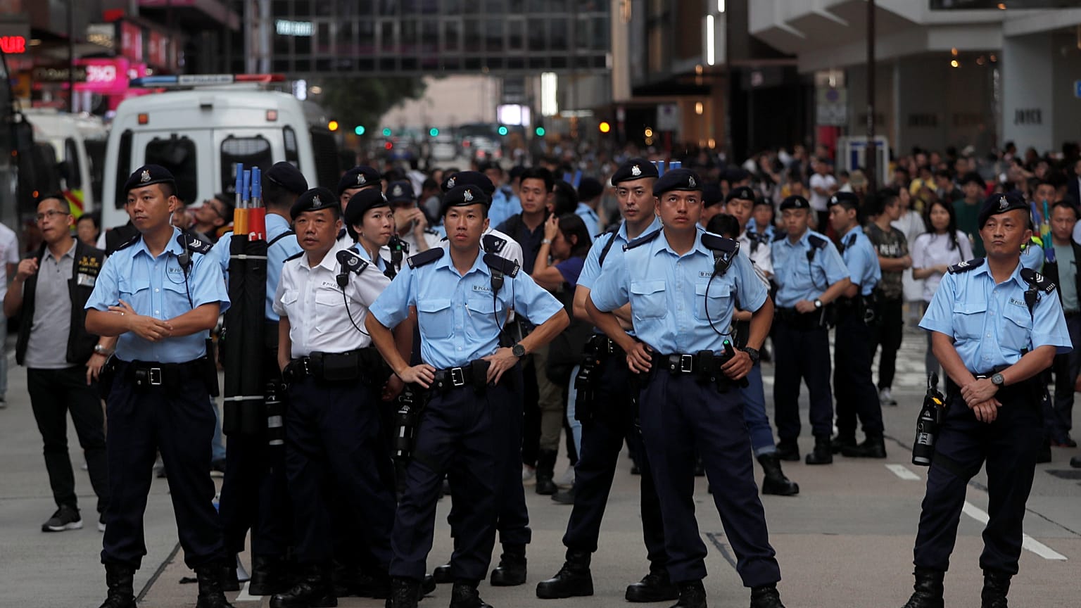 Police stand guard at Hong Kong's tourism district Tsim Sha Tsui during anti-extradition bill protest, China July 7, 2019. Picture taken July 7, 2019. 