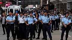 Police stand guard at Hong Kong's tourism district Tsim Sha Tsui during anti-extradition bill protest, China July 7, 2019. Picture taken July 7, 2019. 