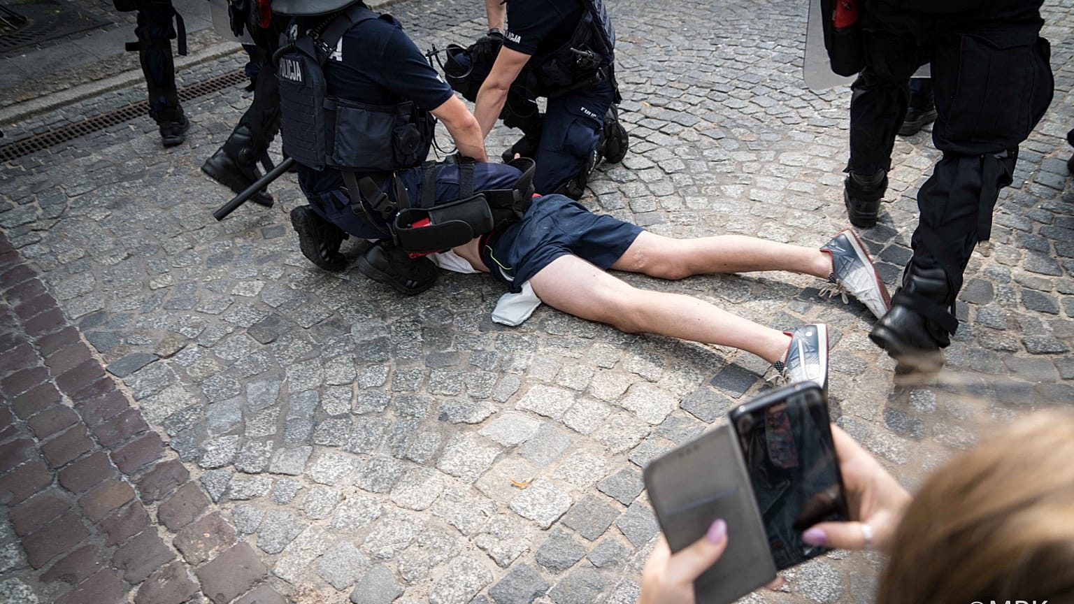 A photo posted on social media of police arresting an anti-LGBT protester