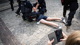 A photo posted on social media of police arresting an anti-LGBT protester