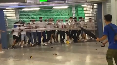 Masked men storm train station in Hong Kong