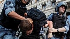 Police officers block a street during a rally calling for opposition candidates to be registered for elections to Moscow City Duma, the capital's regional parliament