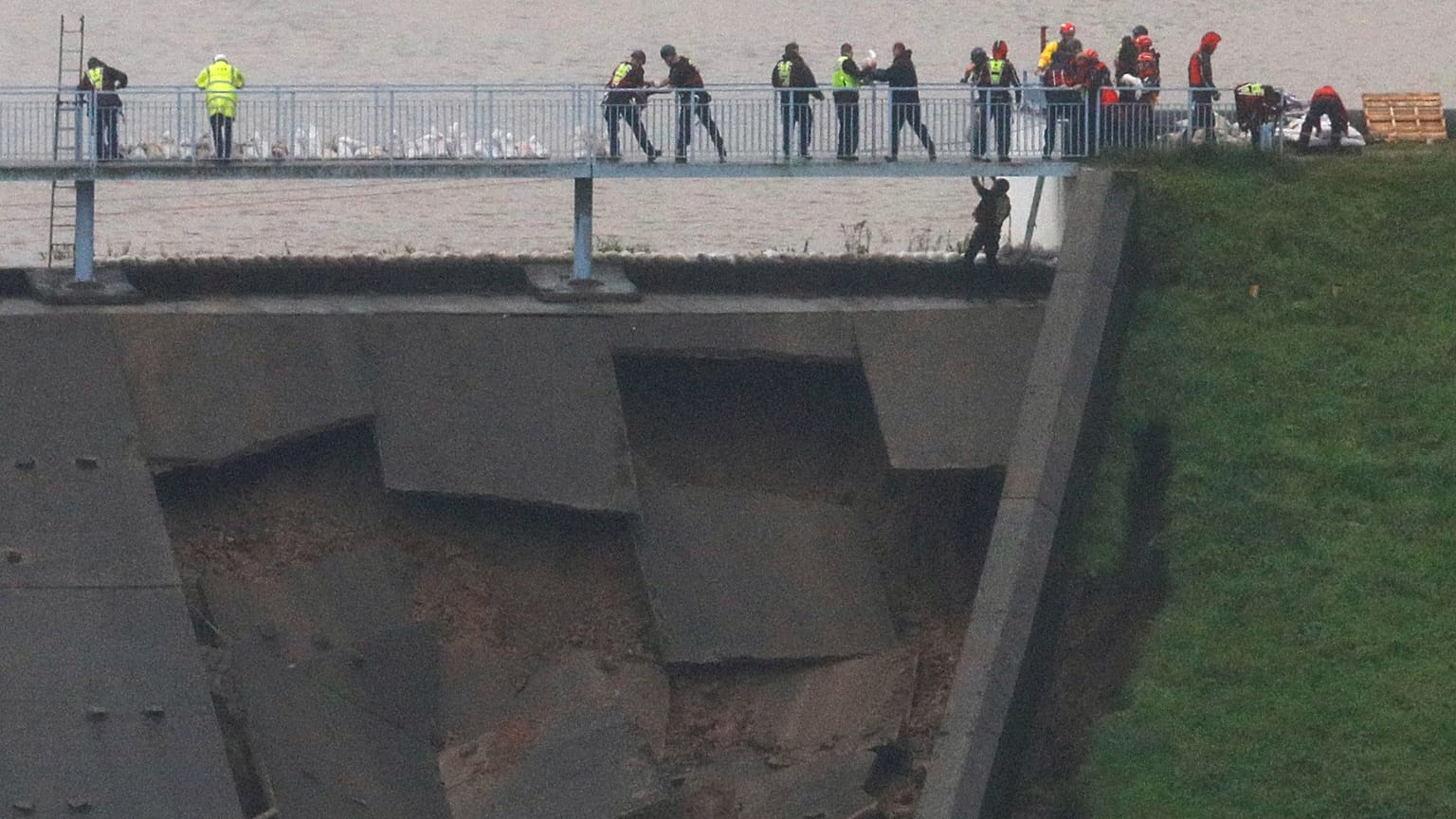 British military helping shore up damaged dam as risk of flooding of UK town rises 